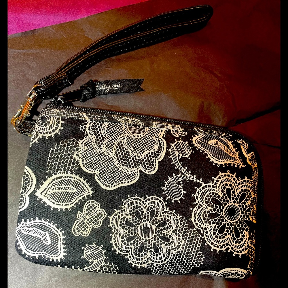 Thirty one’s Corner Zip Wristlet; White Design on Black
